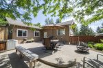 Large and private fenced patio, seated dining with umbrella, hot tub
