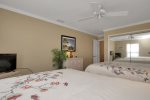Queen guest bedroom with TV