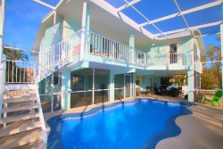 Beautiful Waterfront Home with Screened-in Pool by Sombrero Beach!