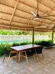 Outdoor tiki area with seating