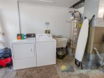 A washer and dryer with a mud sink are located in the garage.