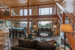 Open style living, dining, and kitchen. Please note: The city does not permit the upstairs loft for use.