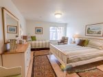 Next is a luxurious bedroom with enough room for a queen and twin day bed.