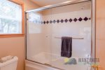 The primary bathroom has a shower and tub combo.
