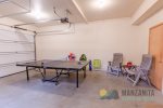 Ping pong and seating area in the garage.