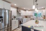 An oversized island provides plenty of room to prepare your favorite meals.
