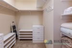 Walk-in closet in the primary bedroom.
