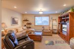 Downstairs has a second living room with a TV.