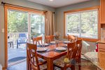 The dining table is next to the door leading to the upper deck, where you can dine outside.