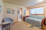 Upstairs there is a twin bedroom. The primary bedroom is accessed from this room.