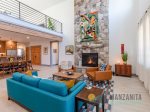 Floor-to-ceiling fireplace in Captain`s Hideaway`s living room.
