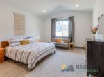 The primary suite has a luxurious king bed.