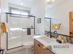 A full bathroom with a walk-in shower is on the second level.