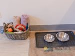 One dog is allowed. We provide linens, potty bags, bowls, etc.