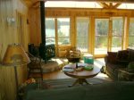 Main level living room w/ walk-out deck