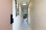 Entryway and hall leading to Kitchen and Living Area