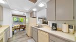 The kitchen is steps away from the dining table