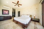 Master bedroom with balcony and ocean views 