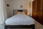 Guest suite with queen bed, private balcony and en suite bathroom