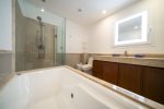 Master bathroom with tub