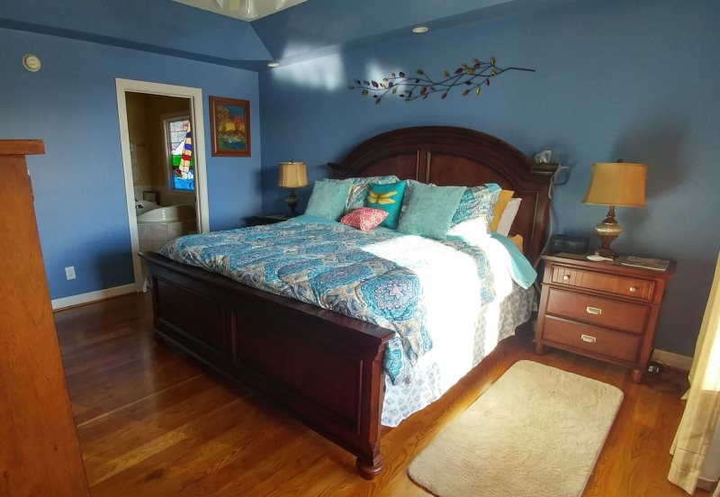 Lake Haven waterfront home with sandy beach and dock perfect for your