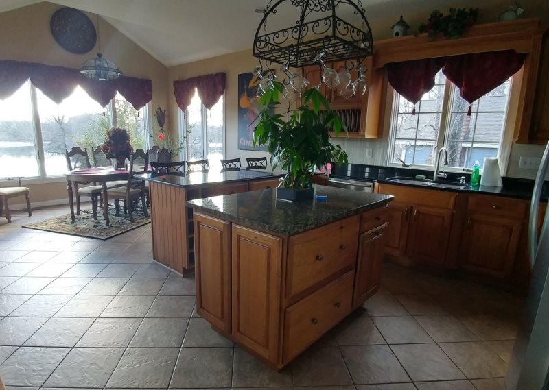 Lake Haven waterfront home with sandy beach and dock perfect for your