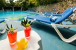Natz Ti Ha poolside with lounges
