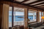 View from the living room to the deck and ocean