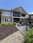 Back exterior with outdoor fireplace