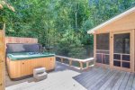 Amazing screen porch, deck, and hot tub surrounded by the woods