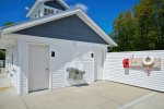 Swimming pool area has an outdoor shower to rinse off and two convenient bathrooms 