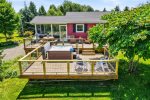 Wonderful tiered decking with eating area, seating area, and hot tub space