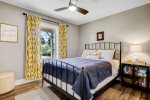 Guest bedroom with a queen bed on the main level 