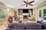 Living room with smart TV opens to the patio outside space 