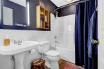 Full bathroom with shower tub combo 