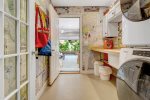 Laundry room leads out to the garage game room