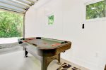 Amazing game room includes a smart TV and lounge area plus a selection of table games and board games