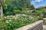 Beautiful gardens surround the patio space 