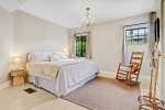 This king bedroom is on the south east of the home and has views overlooking the back garden