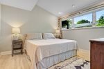 Primary king bedroom ensuite on the south west of the home overlooks the backyard and gardens