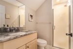 Full bathroom ensuite with a walk in shower 