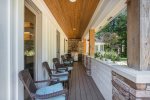 Covered front porch with outdoor furniture 