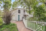 The separate carriage house offers additional accommodations in the warm months 