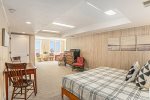 The lower level is one big room sectioned into two areas: sleeping and relaxing