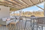 Lower deck with outdoor furniture for dining and relaxing 