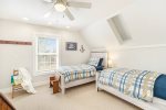 Upper level bedroom with two twin beds 