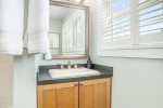 Upper level full bathroom has a vanity area for getting ready 