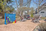 Back patio has lawn games and relaxing places to sit and visit 