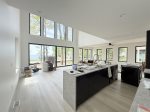 Open great room with soaring ceilings and Lake Michigan views 