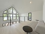 Upper level loft overlooking the great room with Lake Michigan views